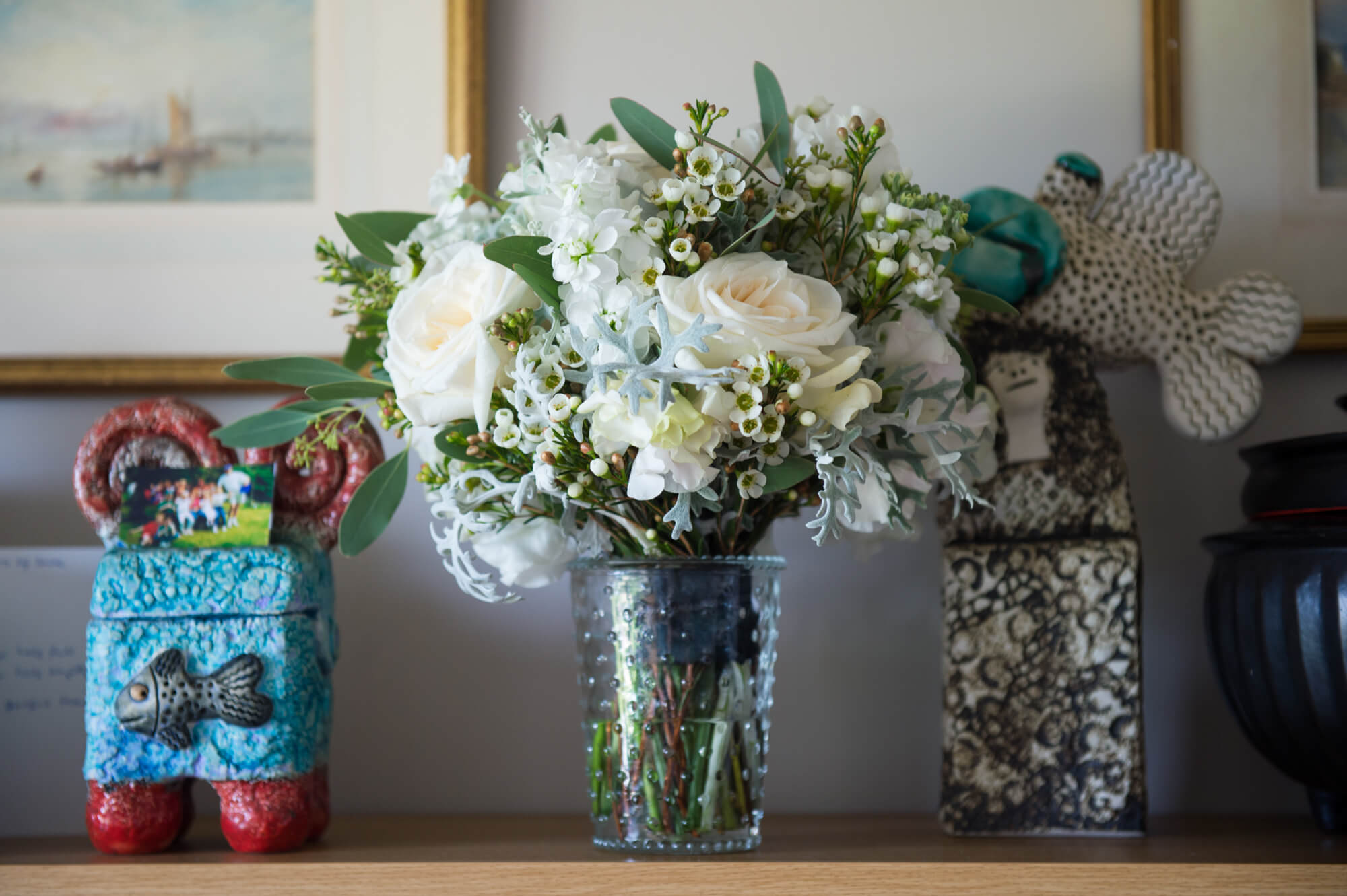 bouquet on a shelf with pretty mexican objects by especially amy wedding photography
